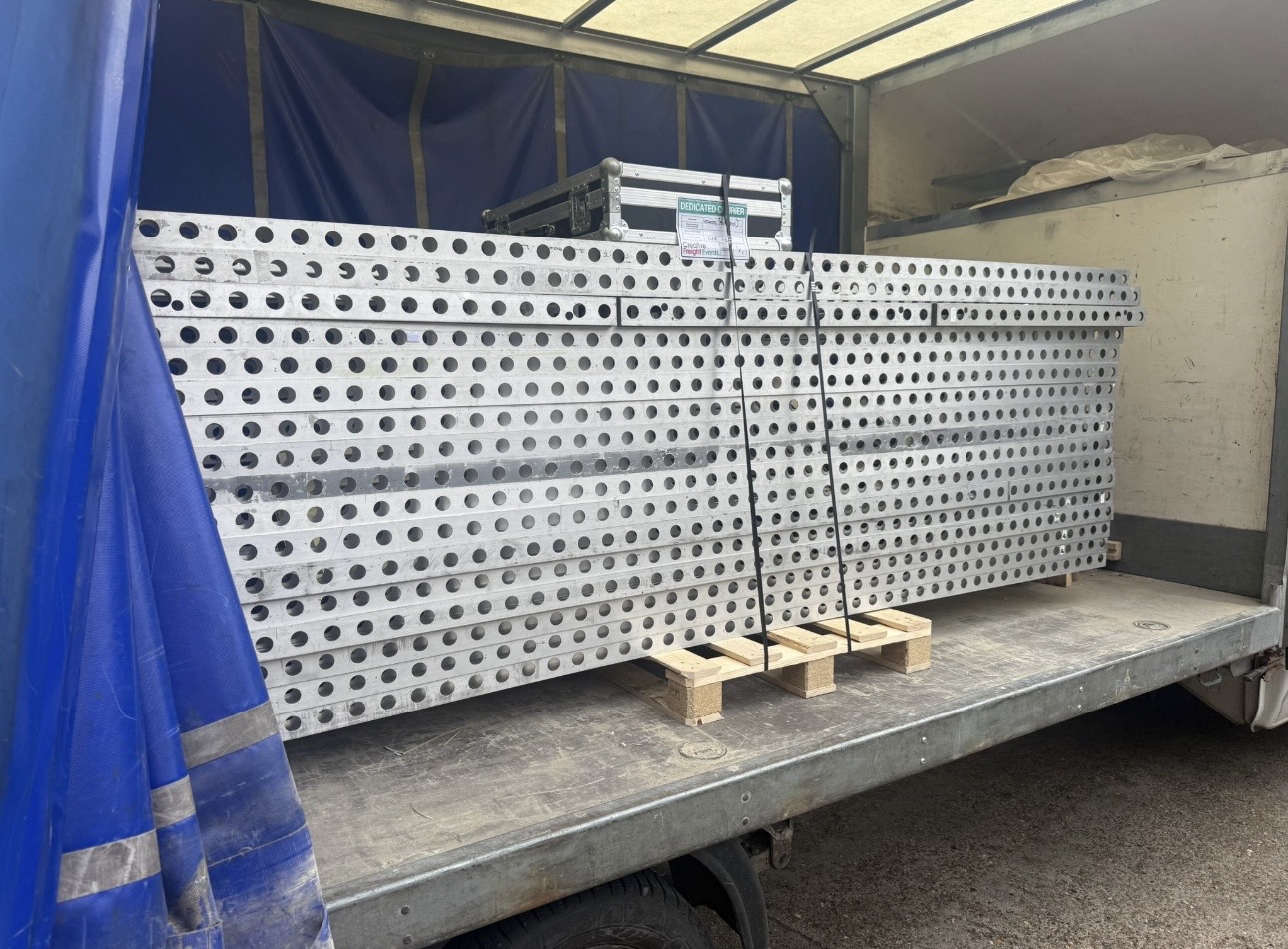 Event freight — aluminium stage decking loaded in van